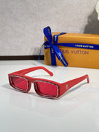 Red rectangular eyeglasses with glossy frames and dark lenses