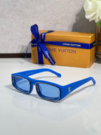 Blue rectangular eyeglasses with glossy frames and dark lenses