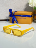 Yellow rectangular eyeglasses with glossy frames and yellow-tinted lenses