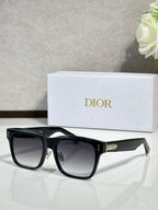 Dior sunglasses with black frames and dark lenses, front view