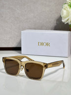 Dior sunglasses with gold frames and brown lenses