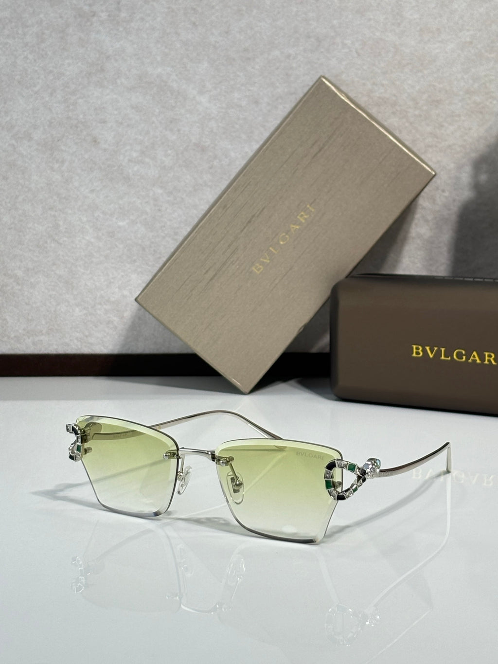 Bvlgari eyeglasses with light green tinted lenses and gold-tone frame