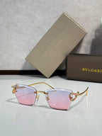 Bvlgari eyeglasses with pink tinted lenses and gold-tone frame