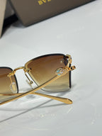 Close-up of Bvlgari eyeglasses with amber tinted lens and gold-tone frame