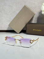 Bvlgari eyeglasses with purple tinted lenses and gold-tone frame