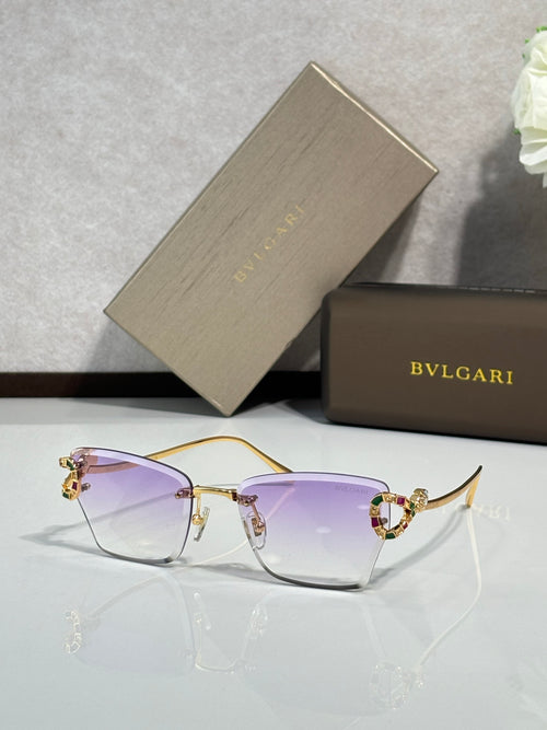 Bvlgari eyeglasses with purple tinted lenses and gold-tone frame