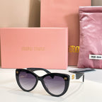 MiuMiu cat-eye sunglasses with black frames and purple-tinted lenses.