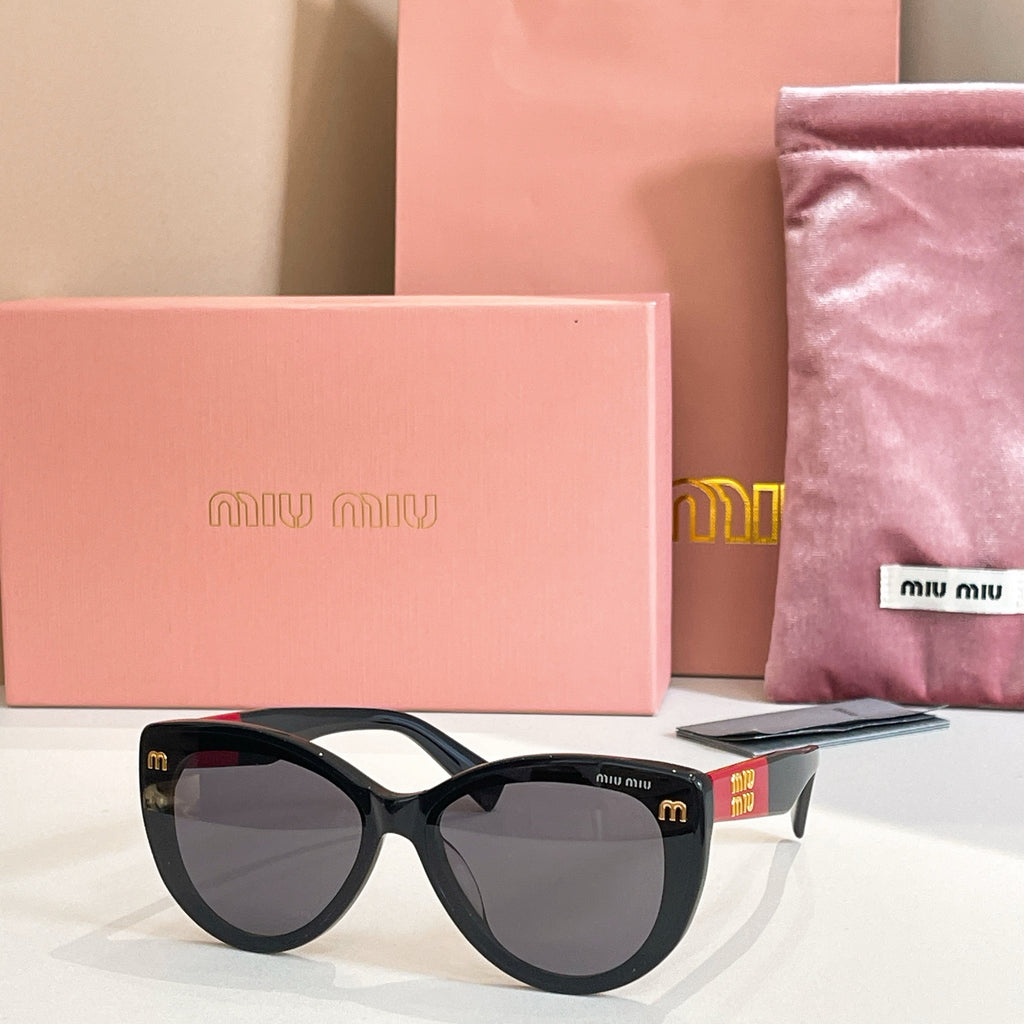 MiuMiu cat-eye sunglasses with black frames and dark lenses.