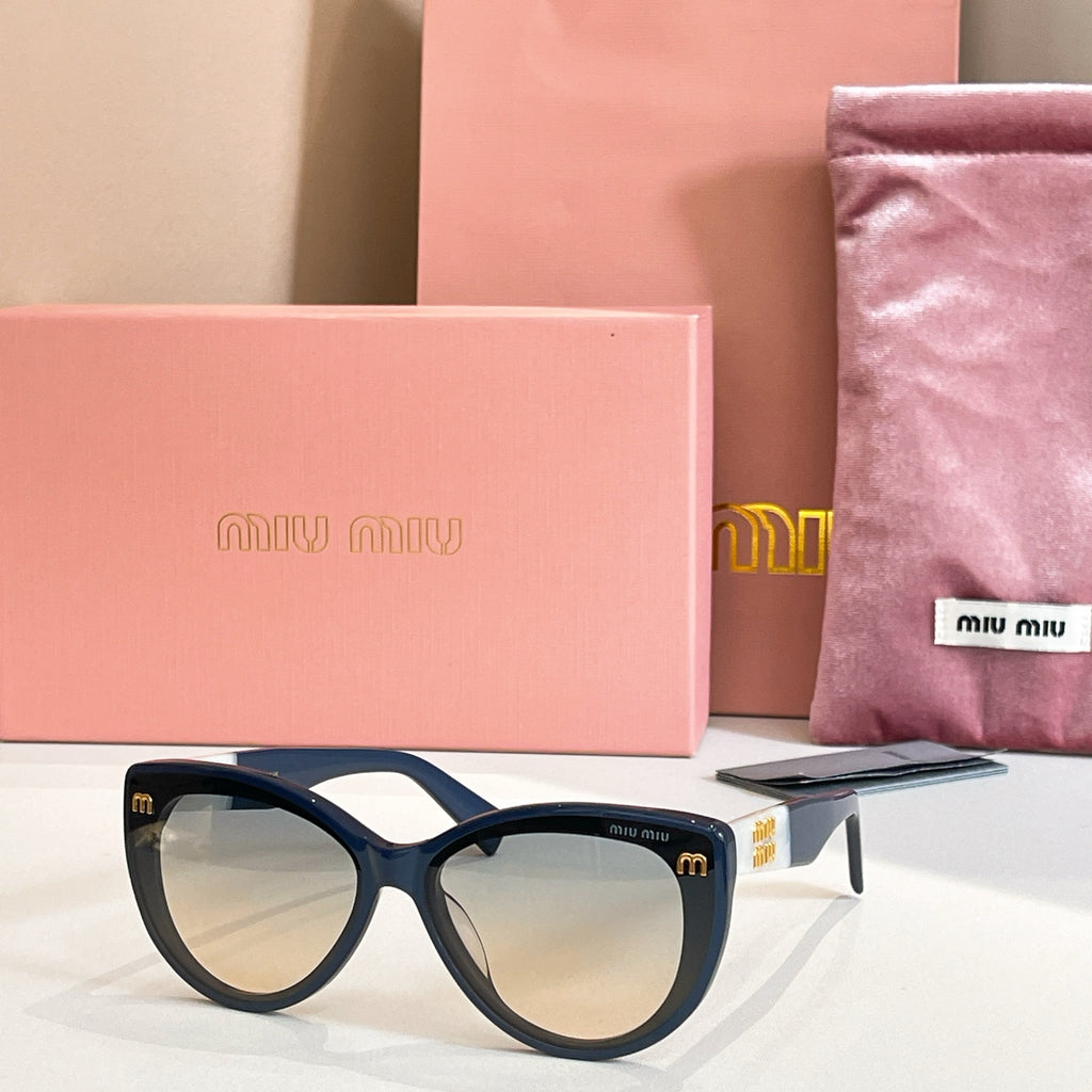 MiuMiu cat-eye sunglasses with navy frames and dark lenses.