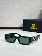 Rectangular sunglasses with green frames, tinted green lenses, gold logo temple detail