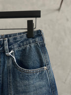 Blue denim pants with side pocket and attached belt loop detail