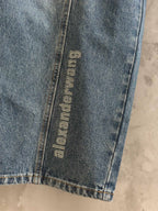 Blue denim pants with vertical “alexanderwang” logo label on side