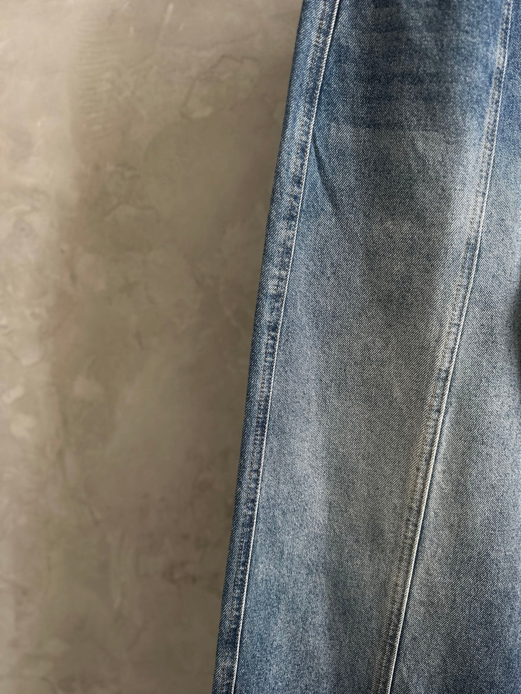 Blue denim pants with straight wide legs and contrast topstitching