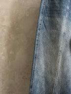 Blue denim pants with straight wide legs and contrast topstitching
