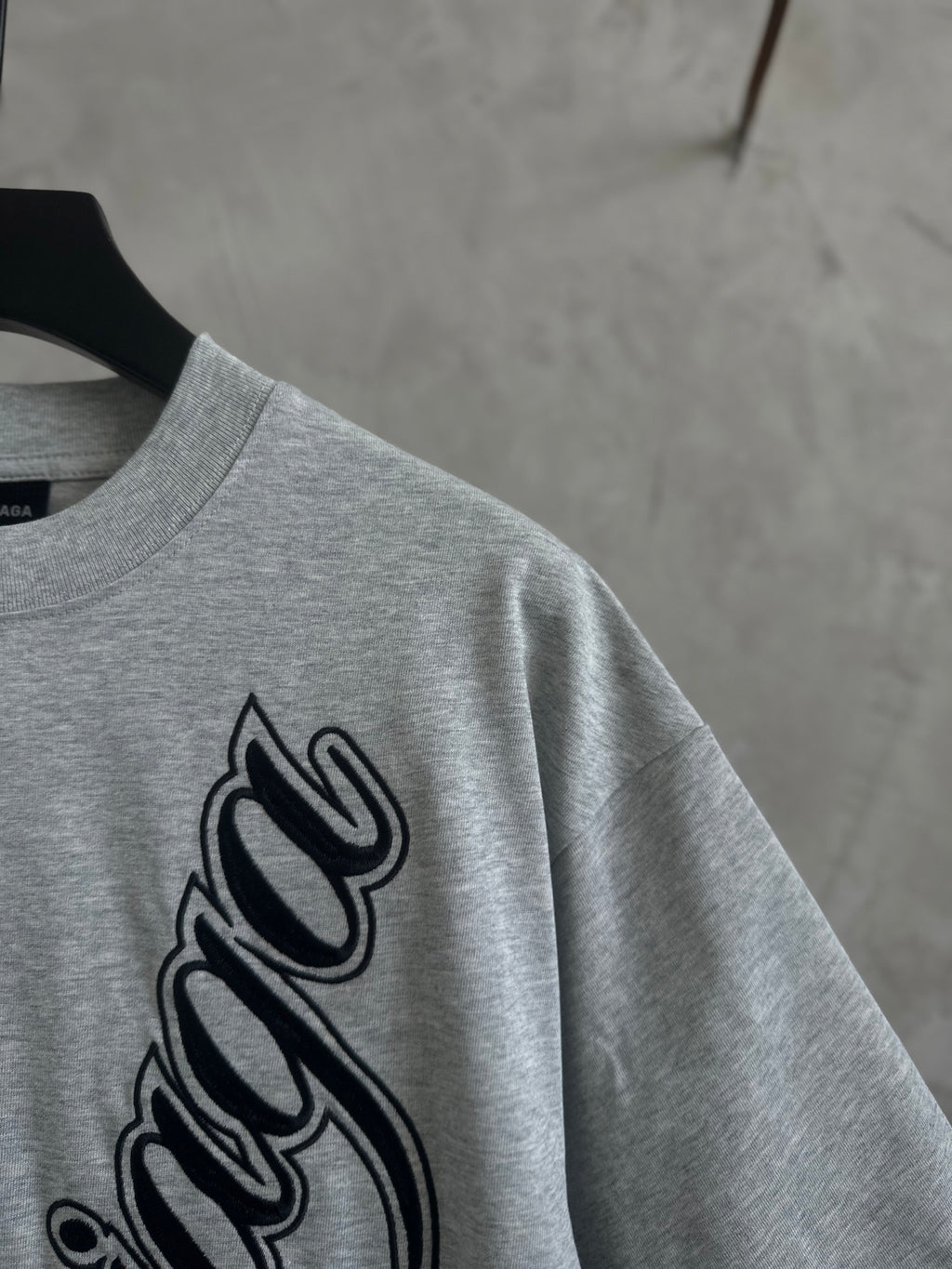 Gray T-shirt sleeve and large Balenciaga script logo print