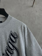Gray T-shirt sleeve and large Balenciaga script logo print
