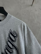 Gray T-shirt close-up of Balenciaga script logo on sleeve