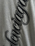 Gray T-shirt close-up of Balenciaga script logo print on front