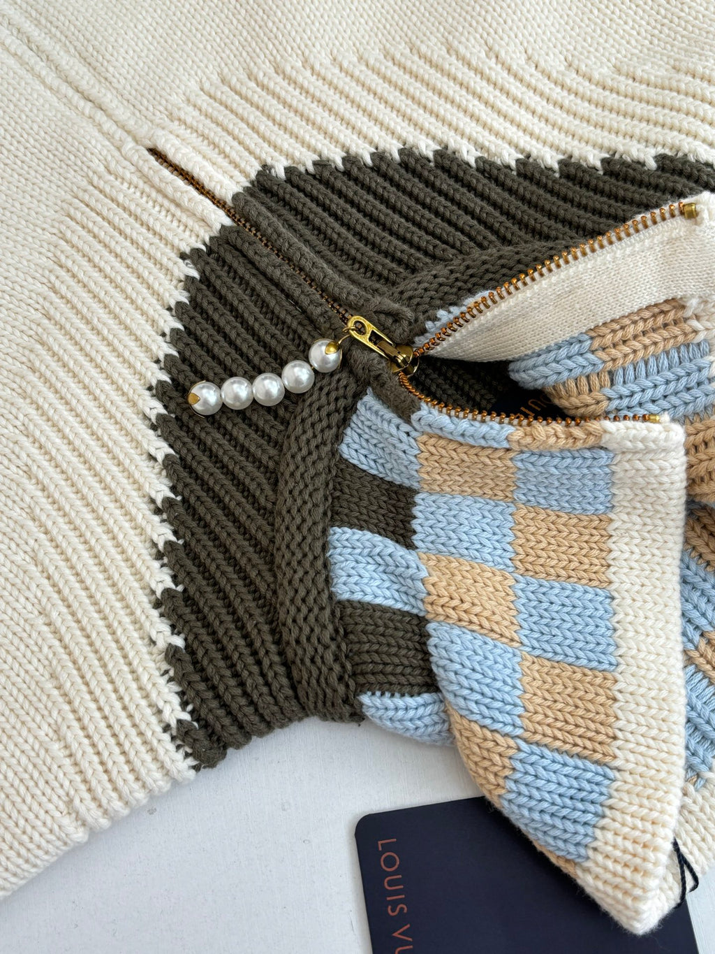 White knit sweater zipper with pearl trim and blue plaid accent panel