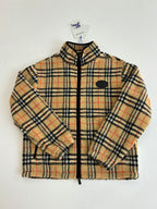 Burberry plaid zip-up jacket close-up with zip front and logo patch