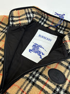 Burberry jacket interior lining with “BURBERRY” label and round logo patch