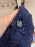Gucci pants waistband detail, Gucci logo metal button and belt loops