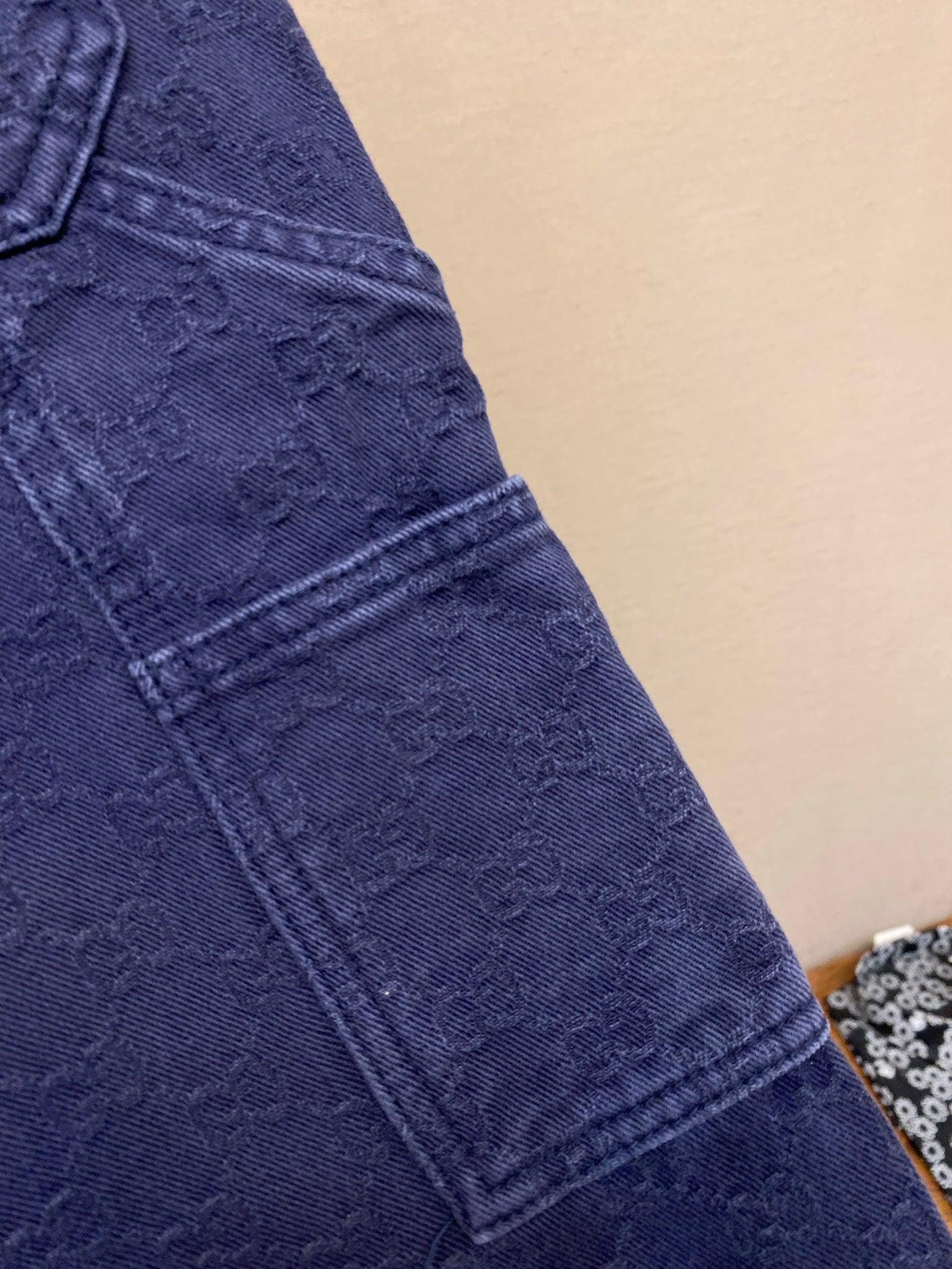 Gucci pants side seam detail, navy woven texture with stitched panel