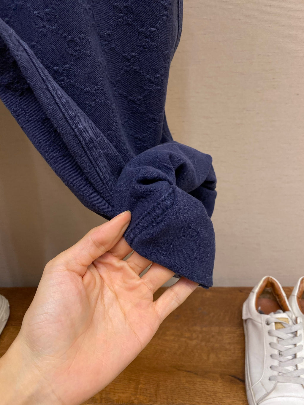 Gucci pants cuff detail, navy fabric with rolled hem and soft fold