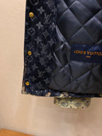 Louis Vuitton quilted lining panel on navy monogram jacket with gold buttons