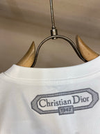 White T-shirt neckline with Christian Dior logo patch