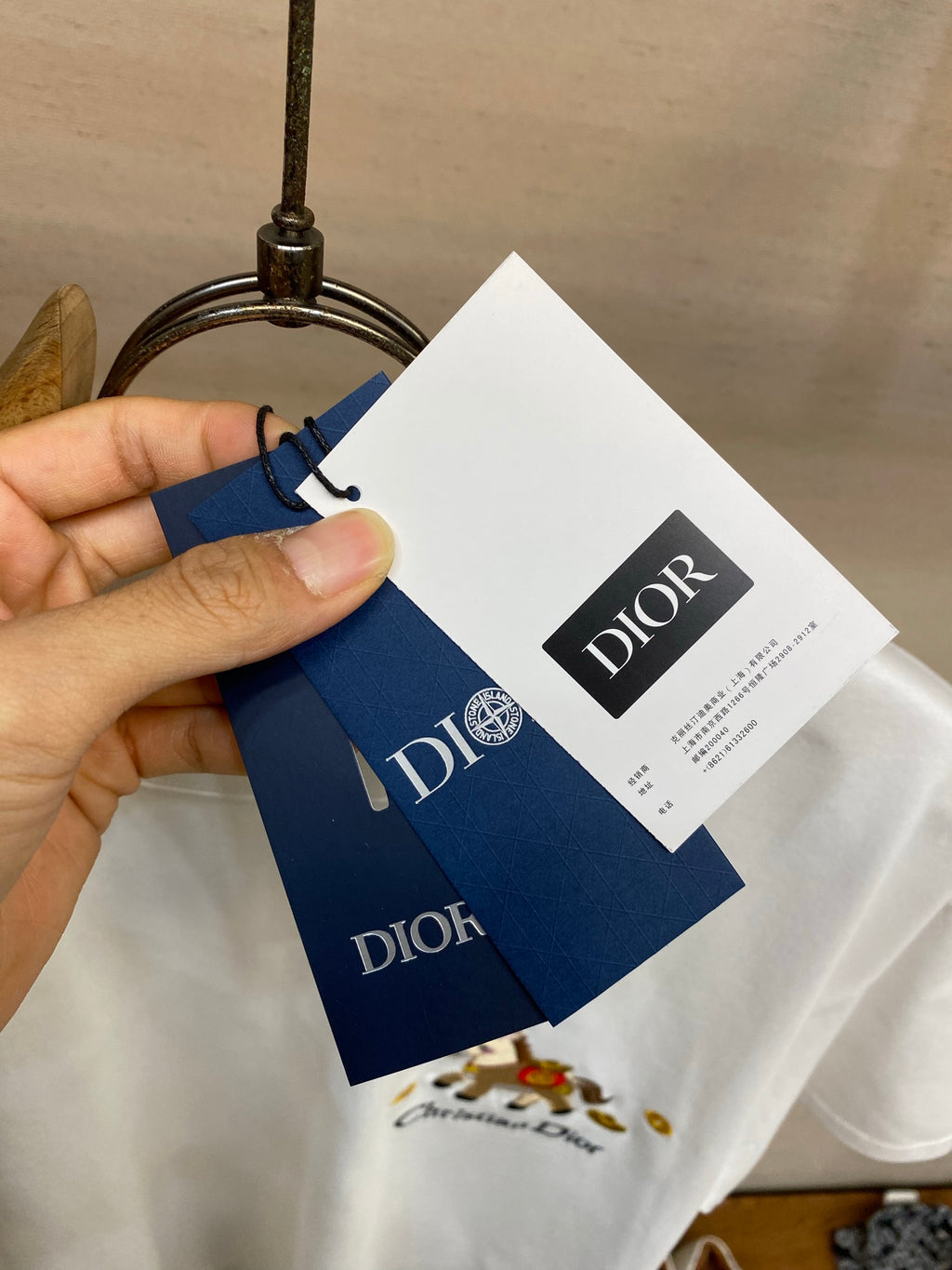 White Christian Dior T-shirt with hanging Dior brand tags