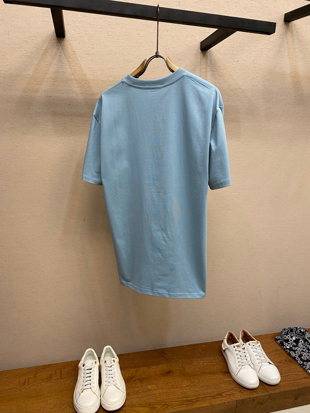 Light blue Gucci crew-neck T-shirt back view with hanging tag