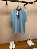 Light blue Gucci crew-neck T-shirt with small chest logo and hanging tag
