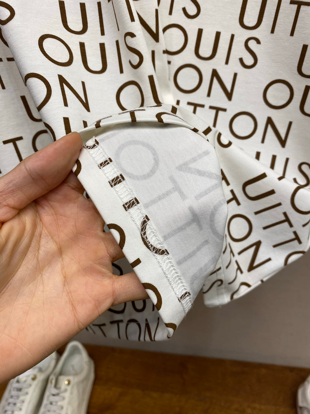 Louis Vuitton monogram T-shirt fabric detail, white with brown logo print