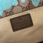Gucci interior fabric patch label on beige lining inside camo-print backpack