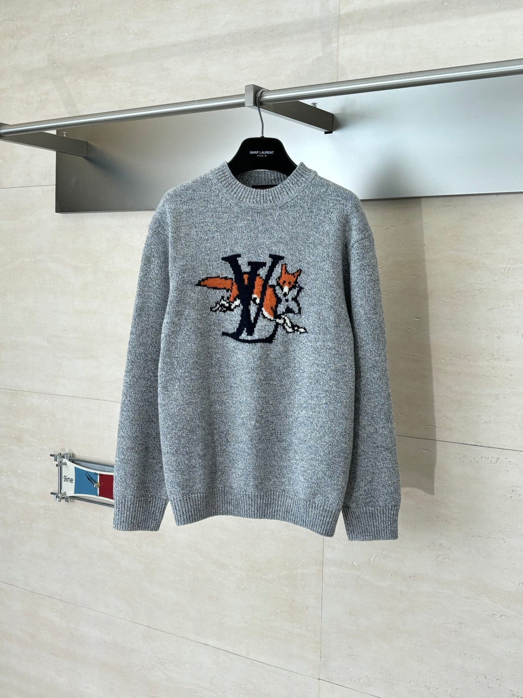 Gray knit sweater with crew neck and colorful cartoon-style LV graphic on front