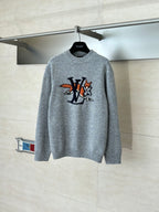 Gray knit sweater with crew neck and colorful cartoon-style LV graphic on front