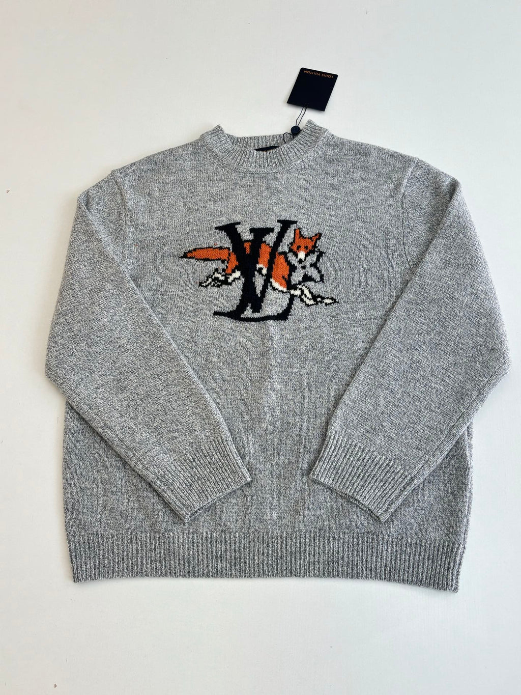 Gray knit sweater front with crew neck and LV-style cartoon graphic