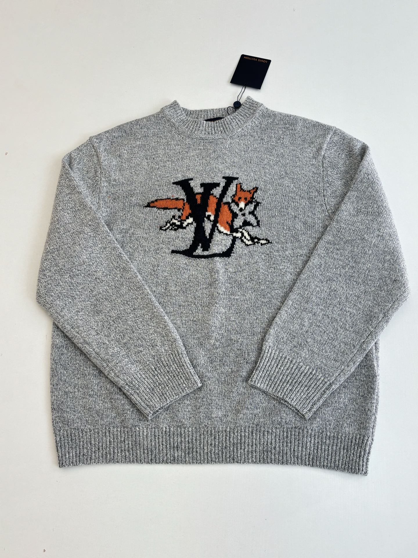 Gray knit sweater front with crew neck and LV-style cartoon graphic
