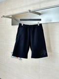Navy drawstring shorts with elastic waistband and small embroidered side logo