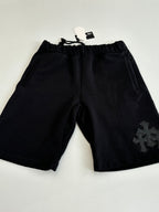 Black drawstring shorts with embroidered side emblem and elastic waistband