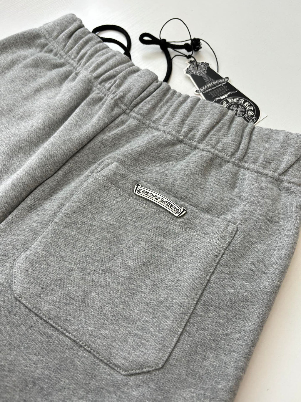 Heather gray shorts with front patch pocket and rectangular brand label
