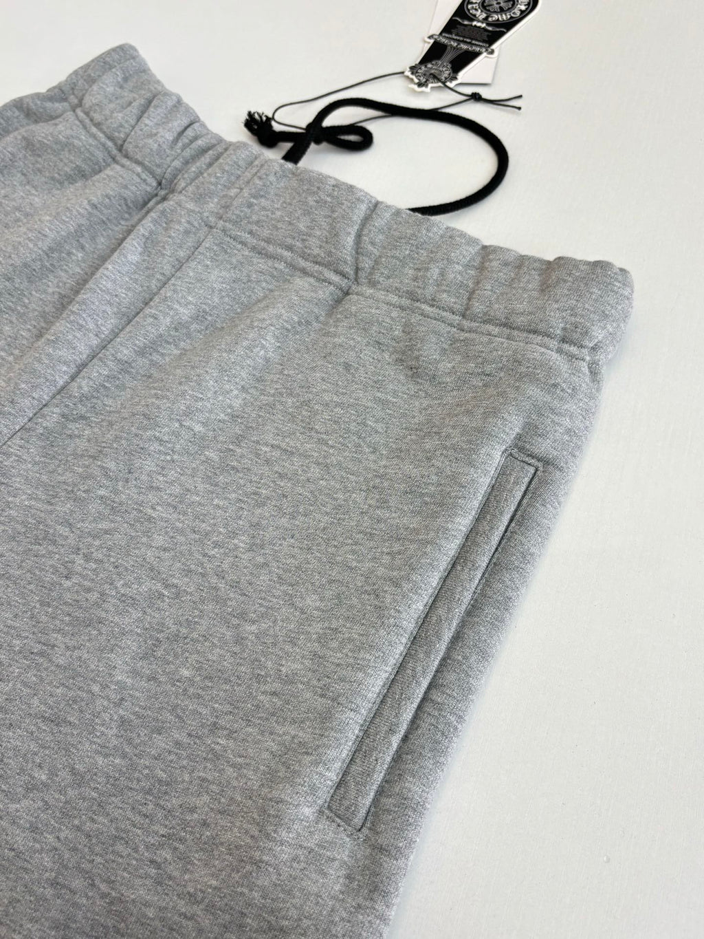 Heather gray shorts with elastic waistband and front seam with side pocket detail