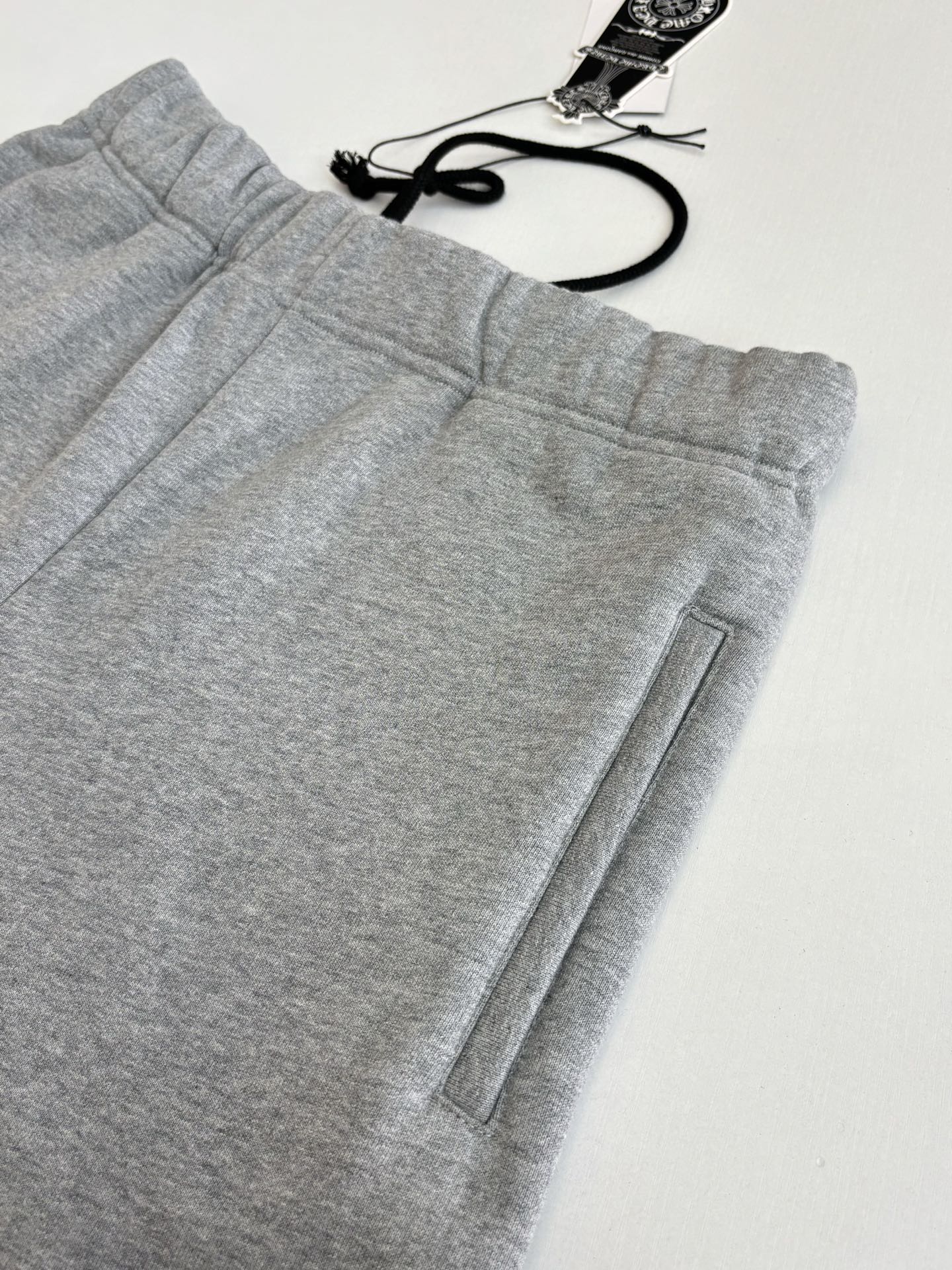 Heather gray shorts with elastic waistband and front seam with side pocket detail