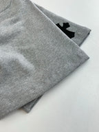 Heather gray shorts with cuffed hem and small black logo patch