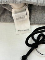 Heather gray shorts with inner fabric tag and black drawstring cord