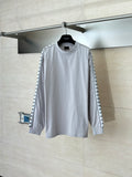 Light gray long-sleeve crewneck top with graphic stripe panels on sleeves