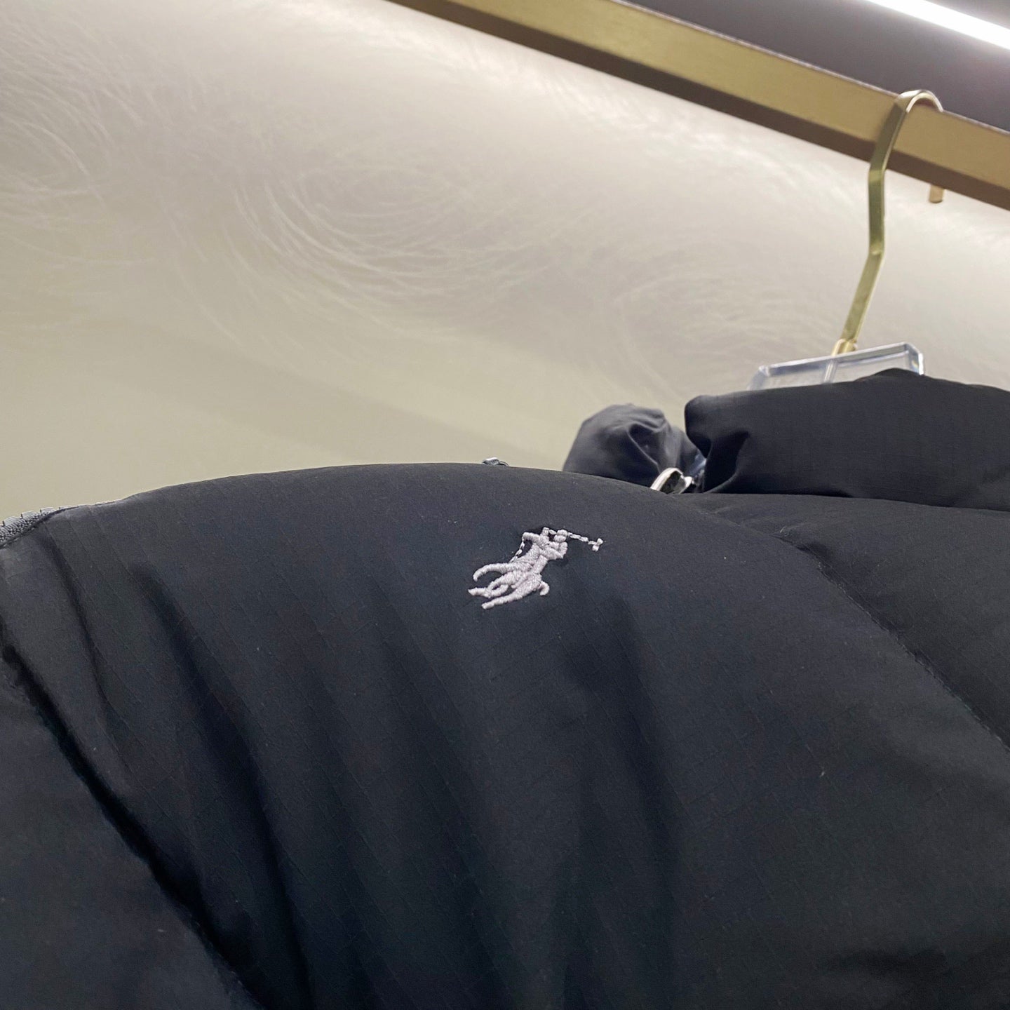 Black Ralph Lauren puffer jacket with embroidered polo logo on chest