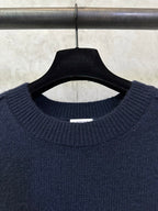 Navy crewneck sweater close-up of ribbed collar and neckline label