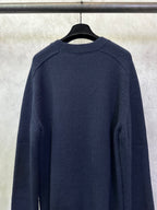 Navy crewneck sweater back view with ribbed cuffs and hem